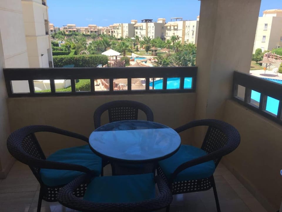 View (from property/room), Balcony/Terrace, Seating area, Dining area, Pool view, Swimming pool