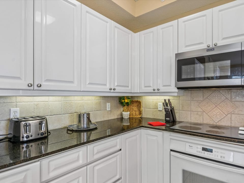 Kitchen or kitchenette, dishwasher, microwave, stove, toaster