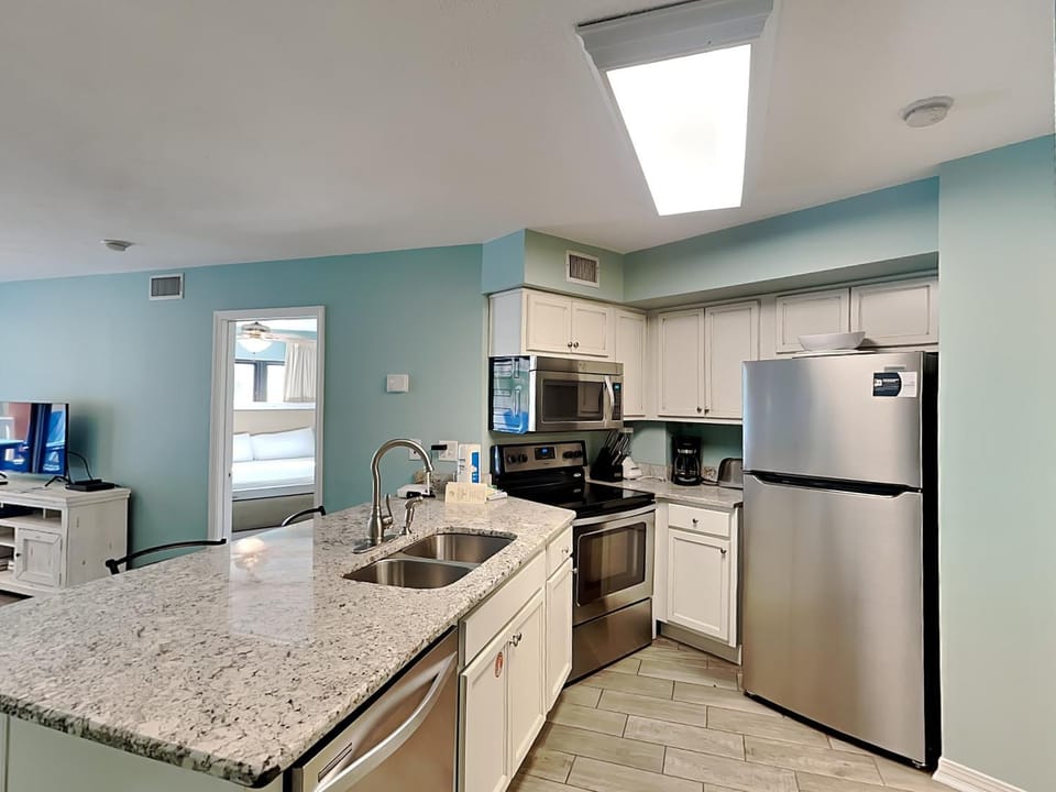 Kitchen or kitchenette, dishwasher, microwave, oven, stove, kitchen