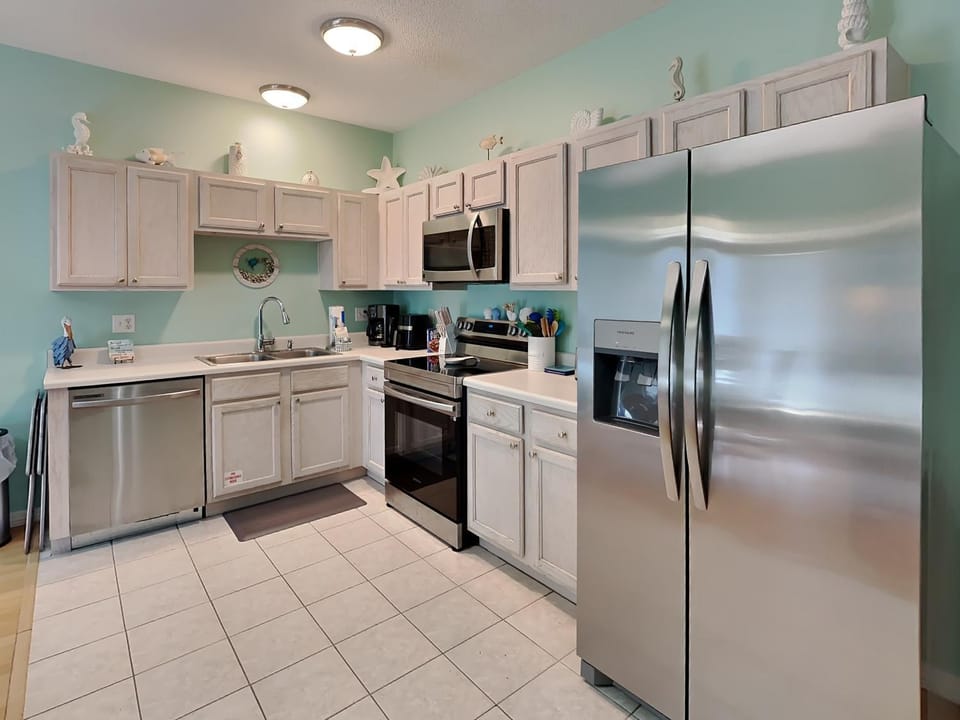 Kitchen or kitchenette, dishwasher, furniture, microwave, oven, stove, kitchen