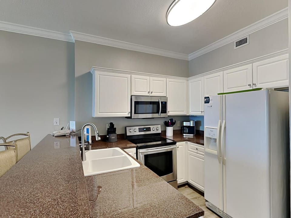 Kitchen or kitchenette, furniture, microwave, oven