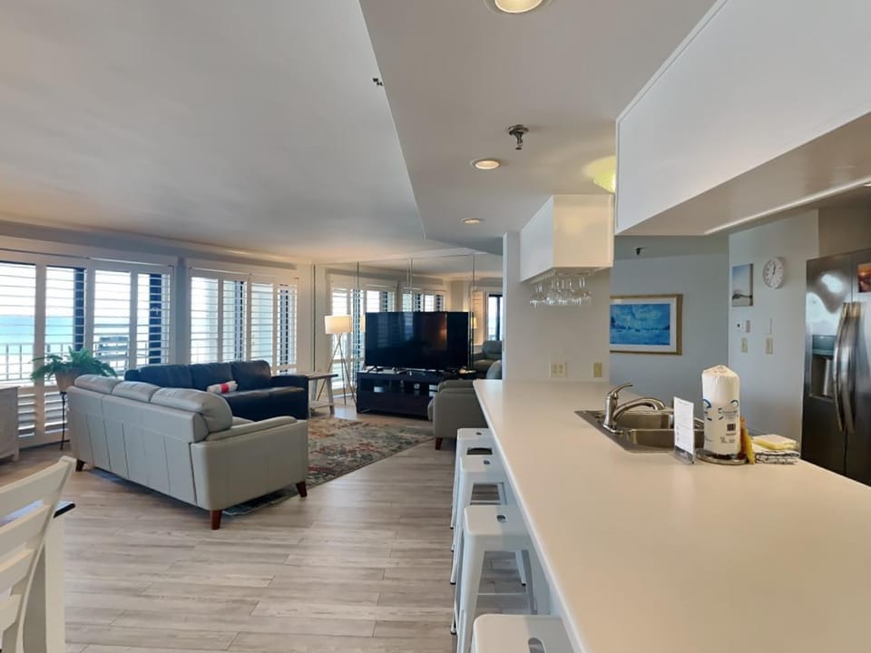 View (from property/room), Kitchen or kitchenette, Living room, Seating area, Sea view, furniture, kitchen
