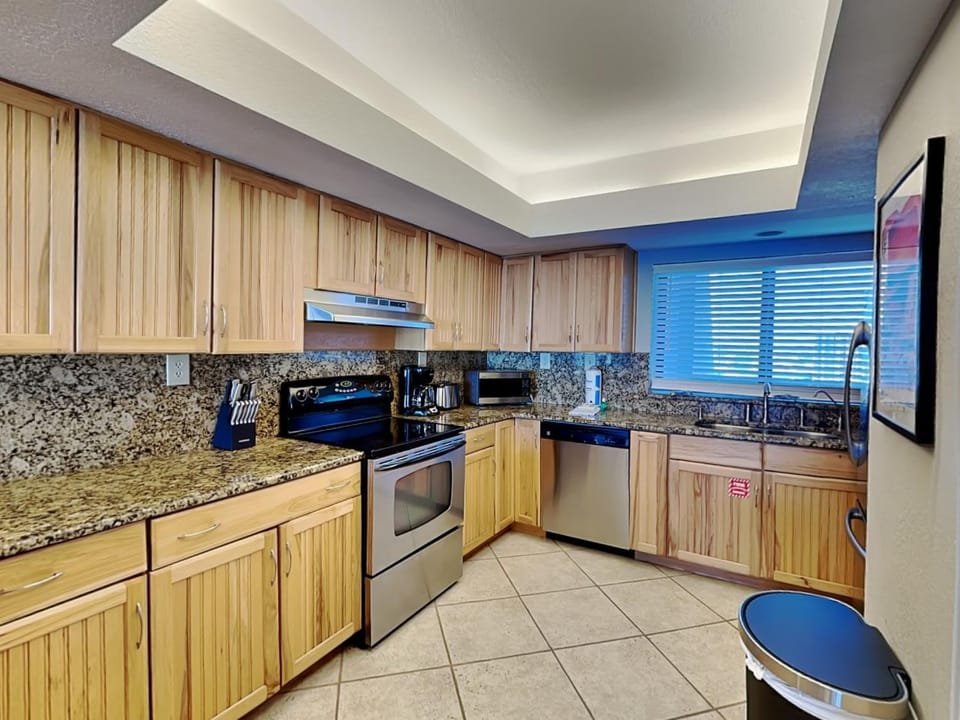 Kitchen or kitchenette, dishwasher, furniture, microwave, oven, stove, washing machine, kitchen