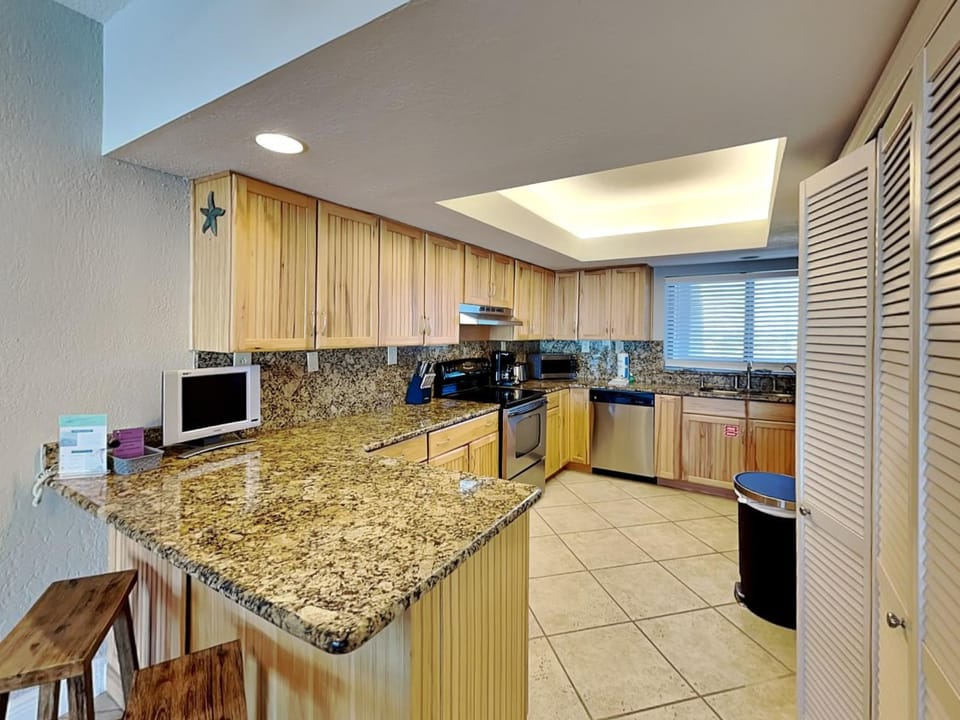 Kitchen or kitchenette, microwave, oven, storage, kitchen