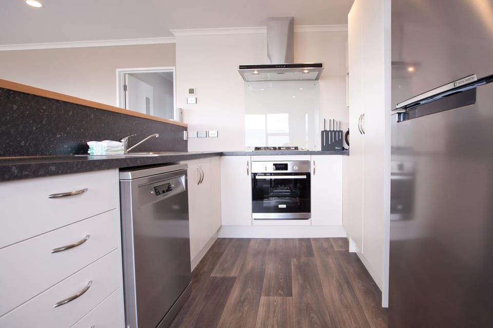 Kitchen or kitchenette, dishwasher, oven, stove, toaster, kitchen