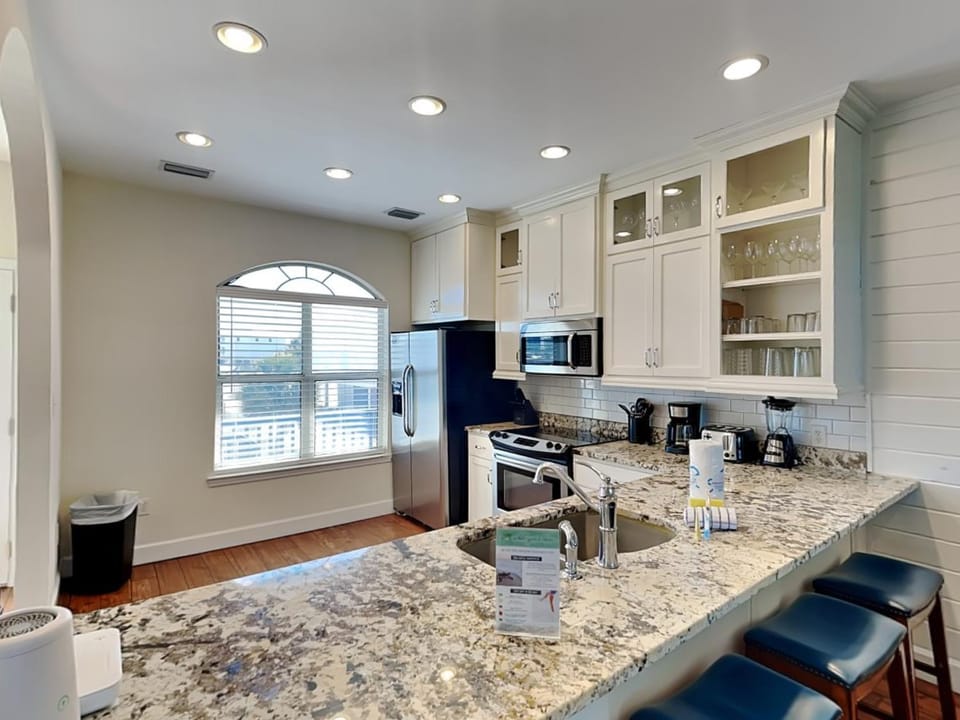 Kitchen or kitchenette, microwave, stove, toaster, kitchen, air conditioner
