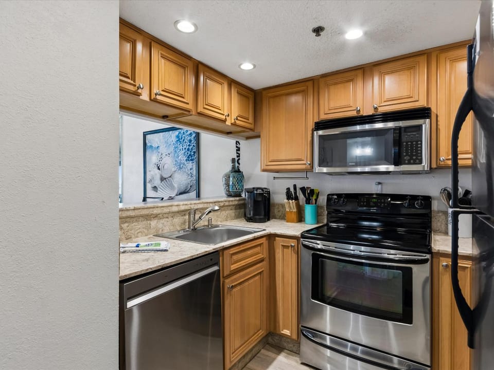 Kitchen or kitchenette, dishwasher, furniture, microwave, oven, stove, kitchen
