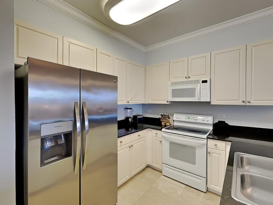 Kitchen or kitchenette, dishwasher, microwave, oven, stove