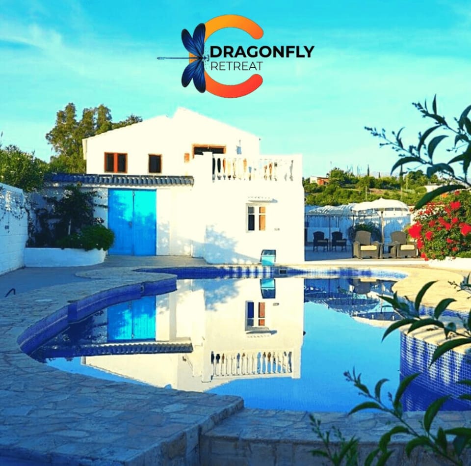 Property building, Day, Property logo or sign, Logo/Certificate/Sign, Text overlay, Pool view, Swimming pool, Certificate/Award