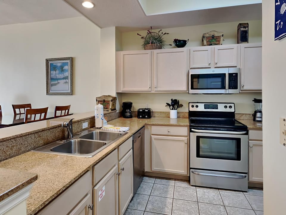 Kitchen or kitchenette, Seating area, Dining area, dishwasher, furniture, microwave, oven, stove, toaster, kitchen