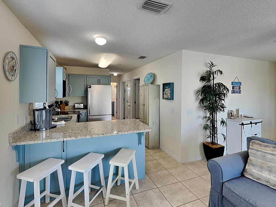 Kitchen or kitchenette, Living room, Seating area, furniture, air conditioner
