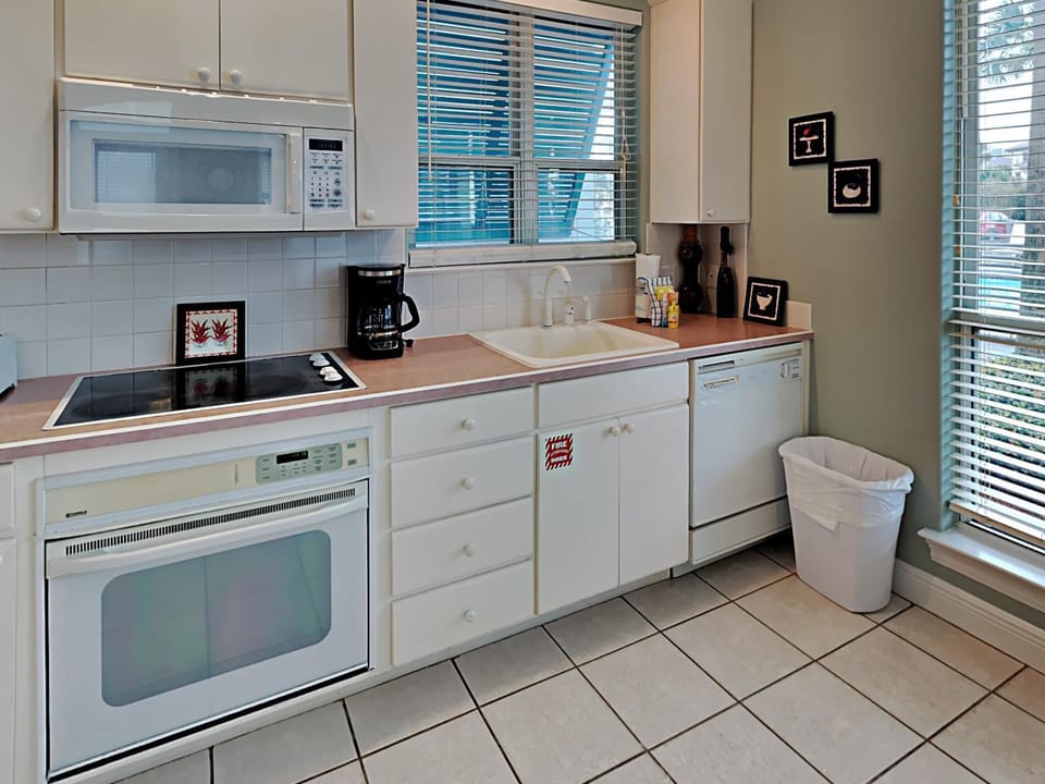 Kitchen or kitchenette, dishwasher, microwave, oven, stove, kitchen