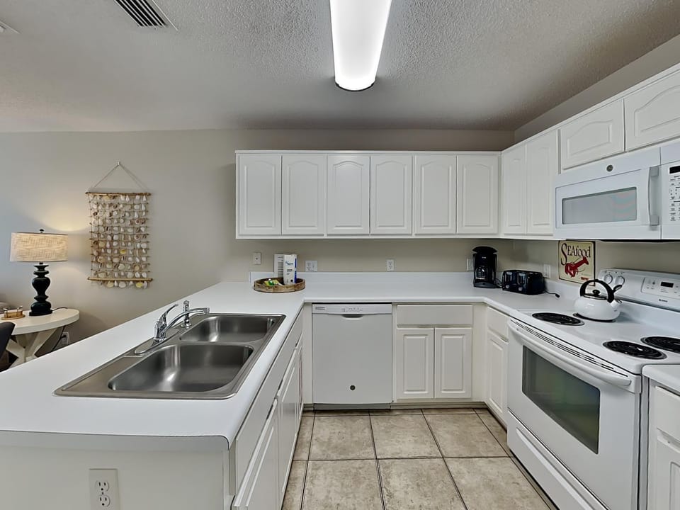 Kitchen or kitchenette, dishwasher, microwave, oven, stove, kitchen