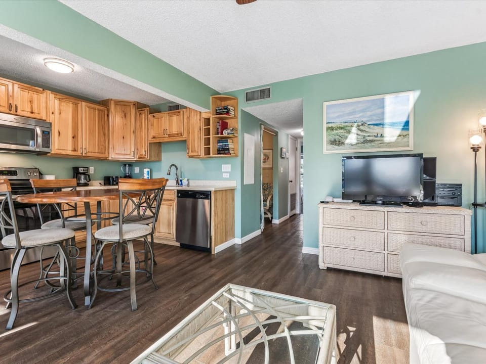TV and multimedia, Kitchen or kitchenette, Living room, Seating area, dishwasher, furniture, microwave, air conditioner
