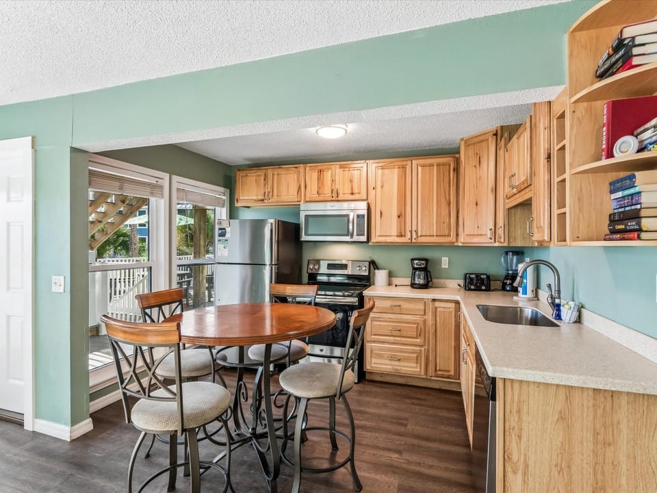 Kitchen or kitchenette, Dining area, furniture, microwave, oven, stove