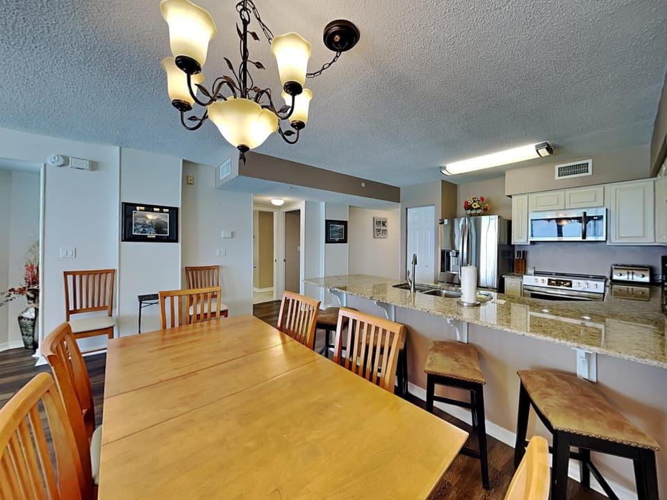 TV and multimedia, Kitchen or kitchenette, Dining area, furniture, oven, stove, air conditioner