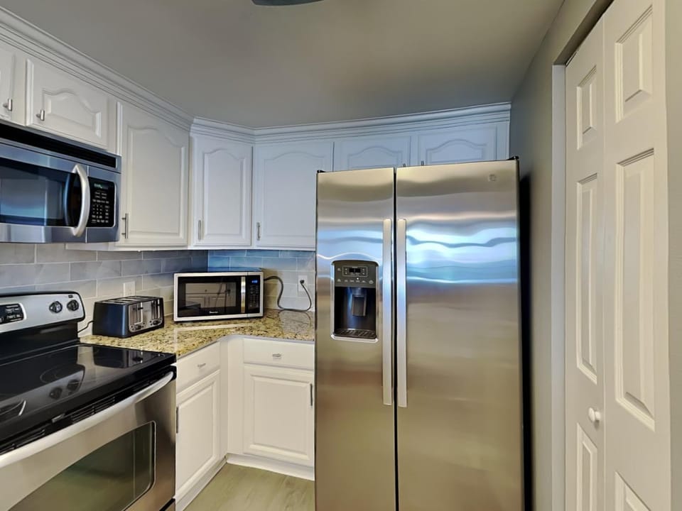 Kitchen or kitchenette, microwave, oven, stove, kitchen