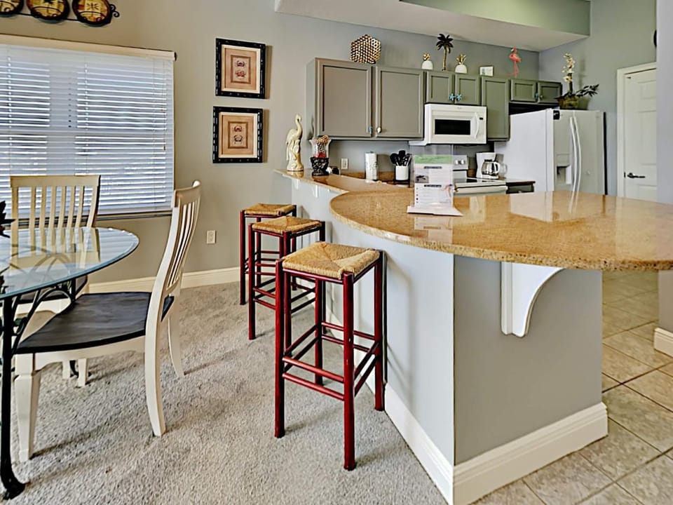 Kitchen or kitchenette, Seating area, Dining area, furniture, microwave, oven, stove, towels, kitchen