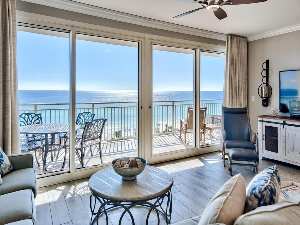 View (from property/room), Balcony/Terrace, Living room, Seating area, Beach, Sea view, furniture