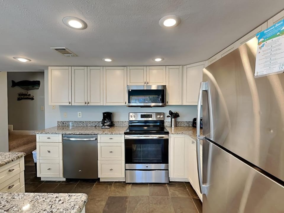 Kitchen or kitchenette, dishwasher, microwave, oven, stove, kitchen