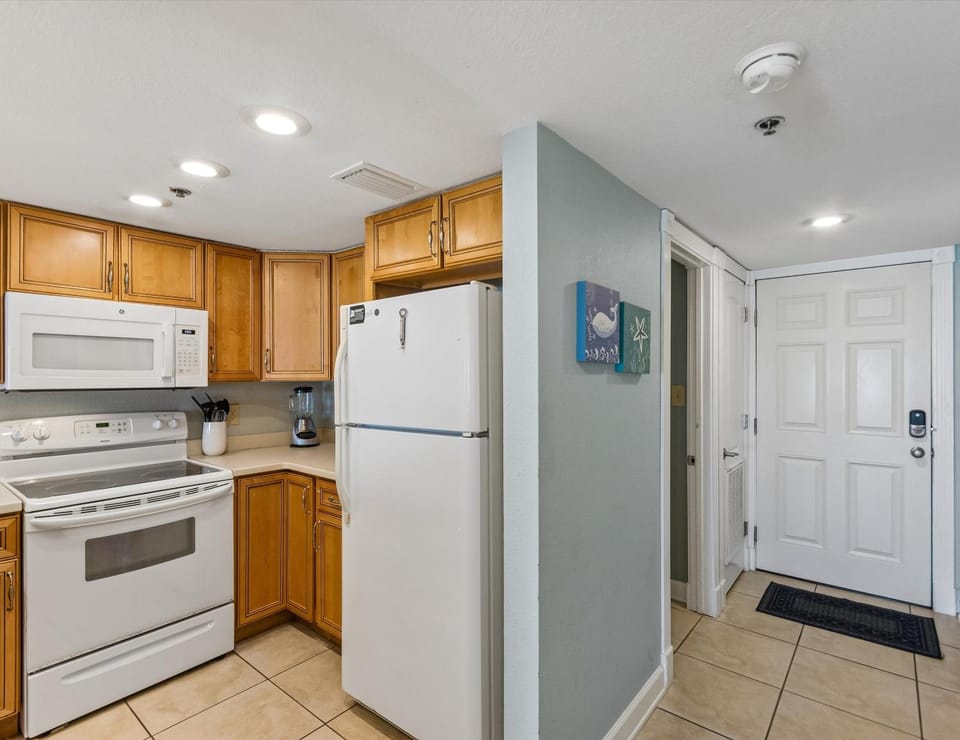 Kitchen or kitchenette, microwave, oven, stove, kitchen, air conditioner