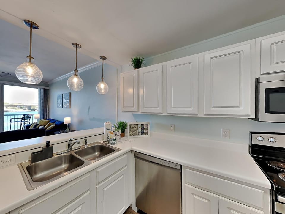 Kitchen or kitchenette, Living room, dishwasher, furniture, microwave, stove