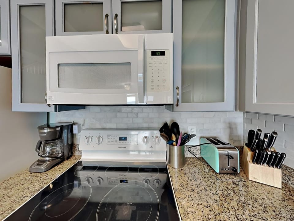 Kitchen or kitchenette, microwave, oven, stove, toaster, kitchen
