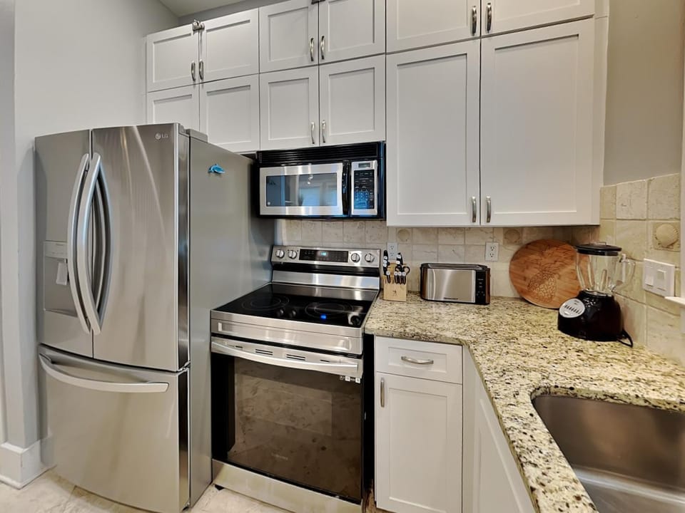 Kitchen or kitchenette, microwave, oven, stove, kitchen