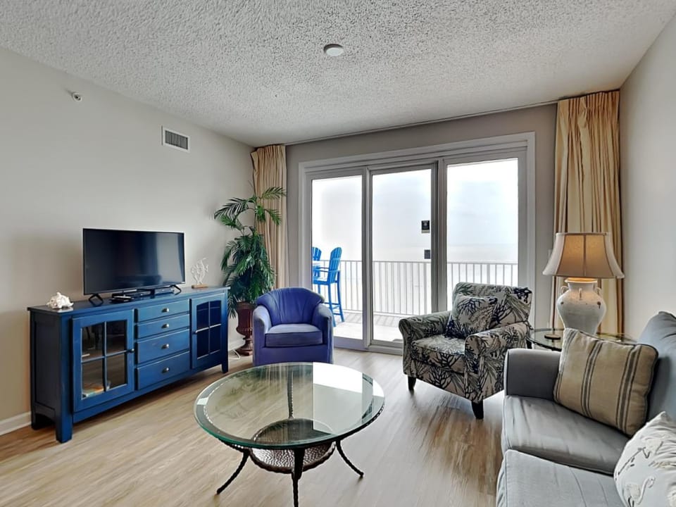 TV and multimedia, Balcony/Terrace, Living room, Seating area, furniture, air conditioner