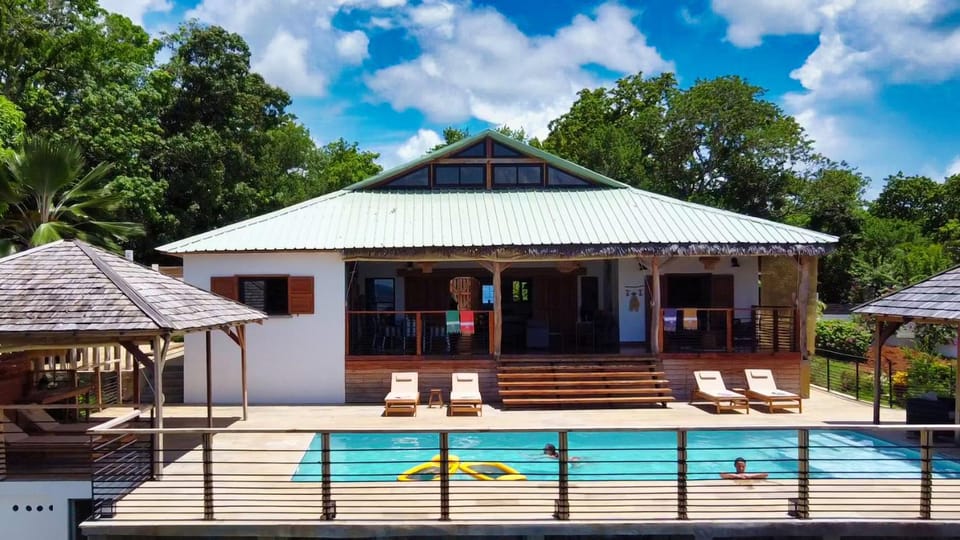 Property building, Patio, Natural landscape, Garden, Pool view, Swimming pool, sunbed