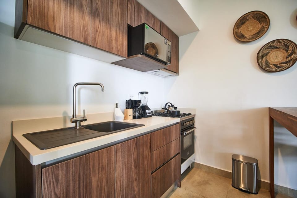 Kitchen or kitchenette, microwave, oven, stove