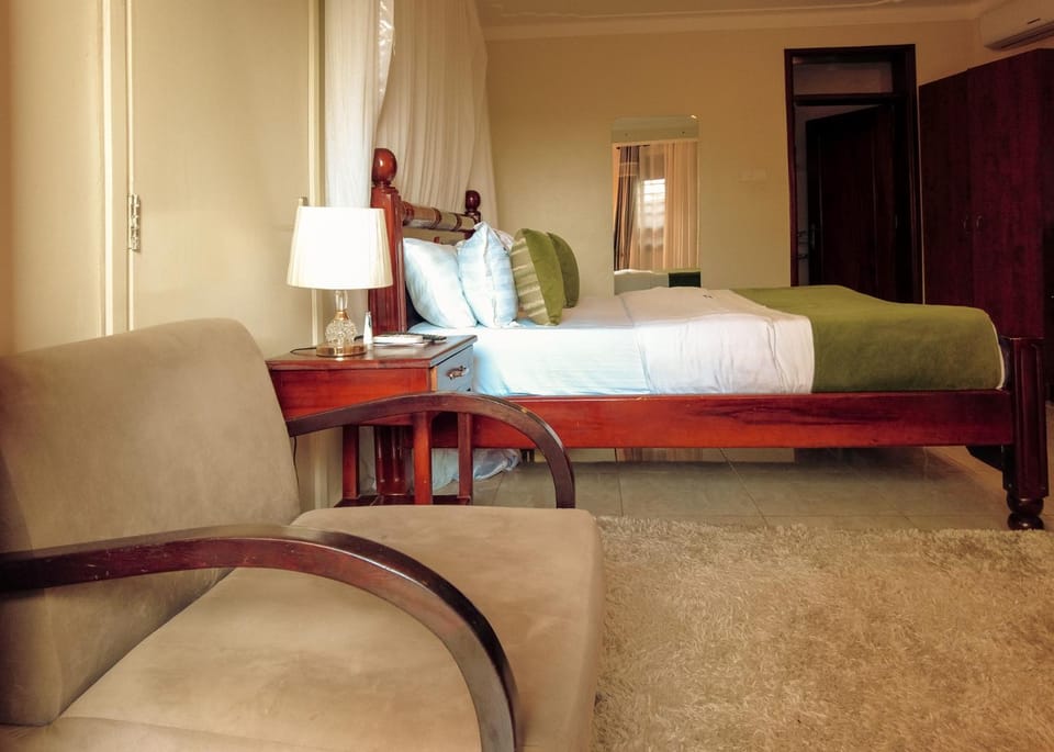 Bed, Living room, Seating area, Bedroom