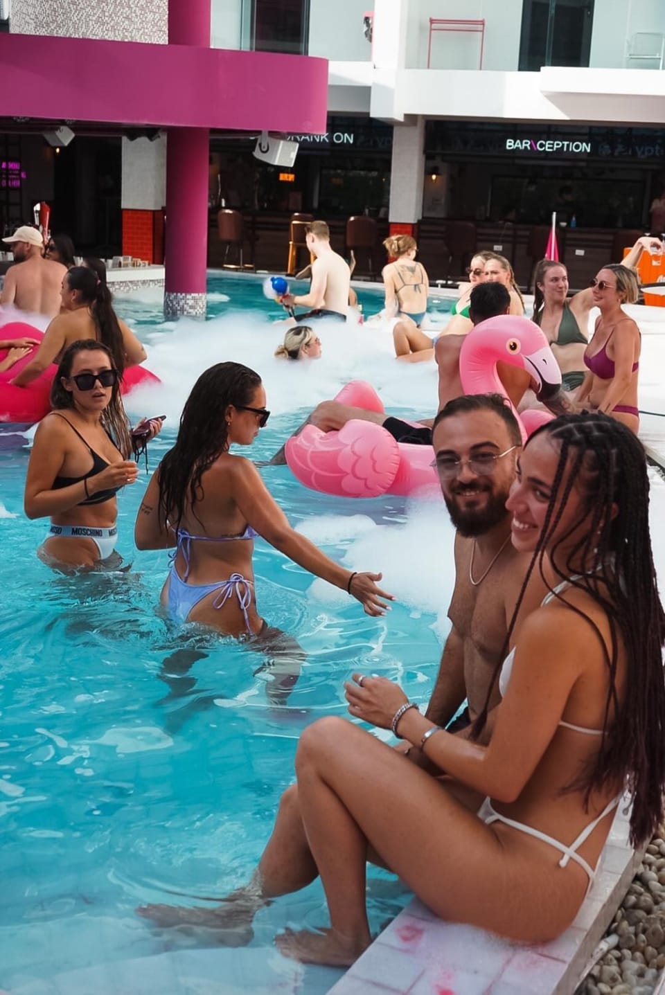 Swimming pool, group of guests, sunbed