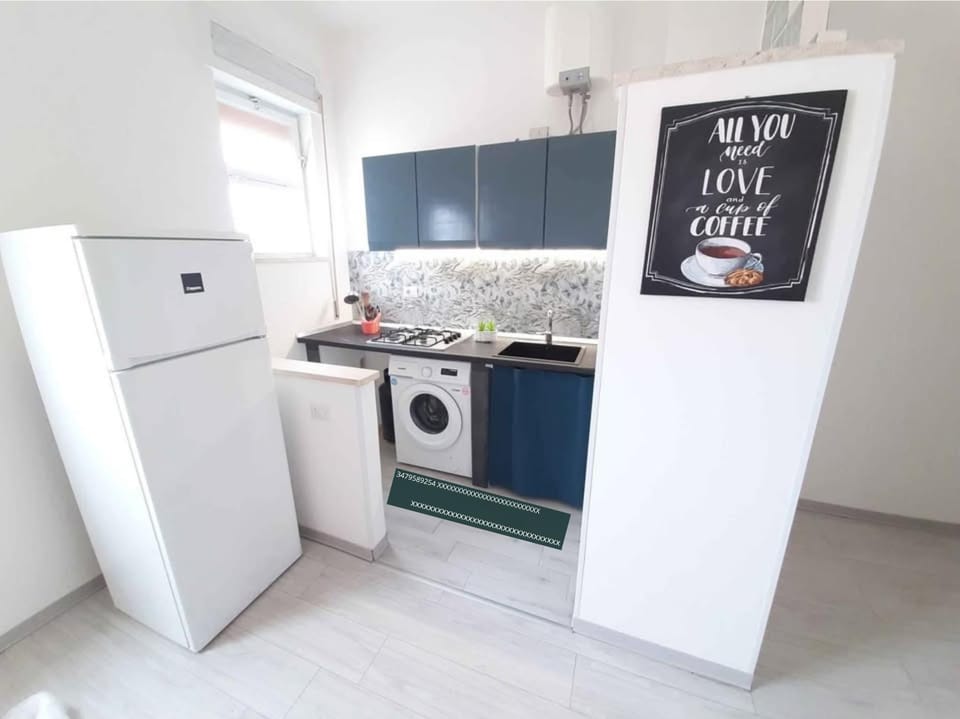 Kitchen or kitchenette, stove, washing machine