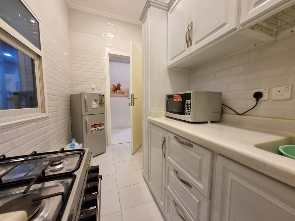 Kitchen or kitchenette, oven, stove