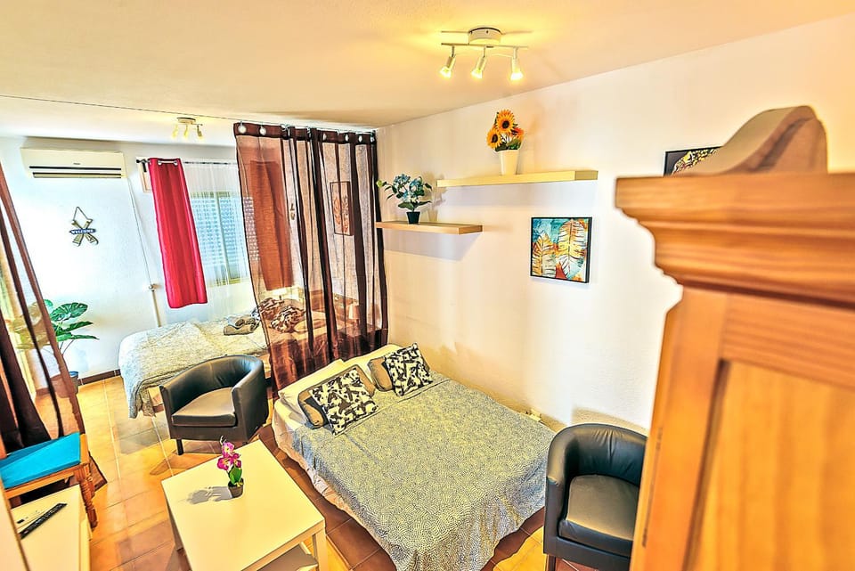 Bed, Living room, Seating area, Bedroom