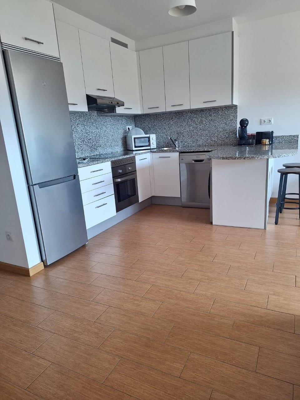 Kitchen or kitchenette, dishwasher, oven, stove, toaster