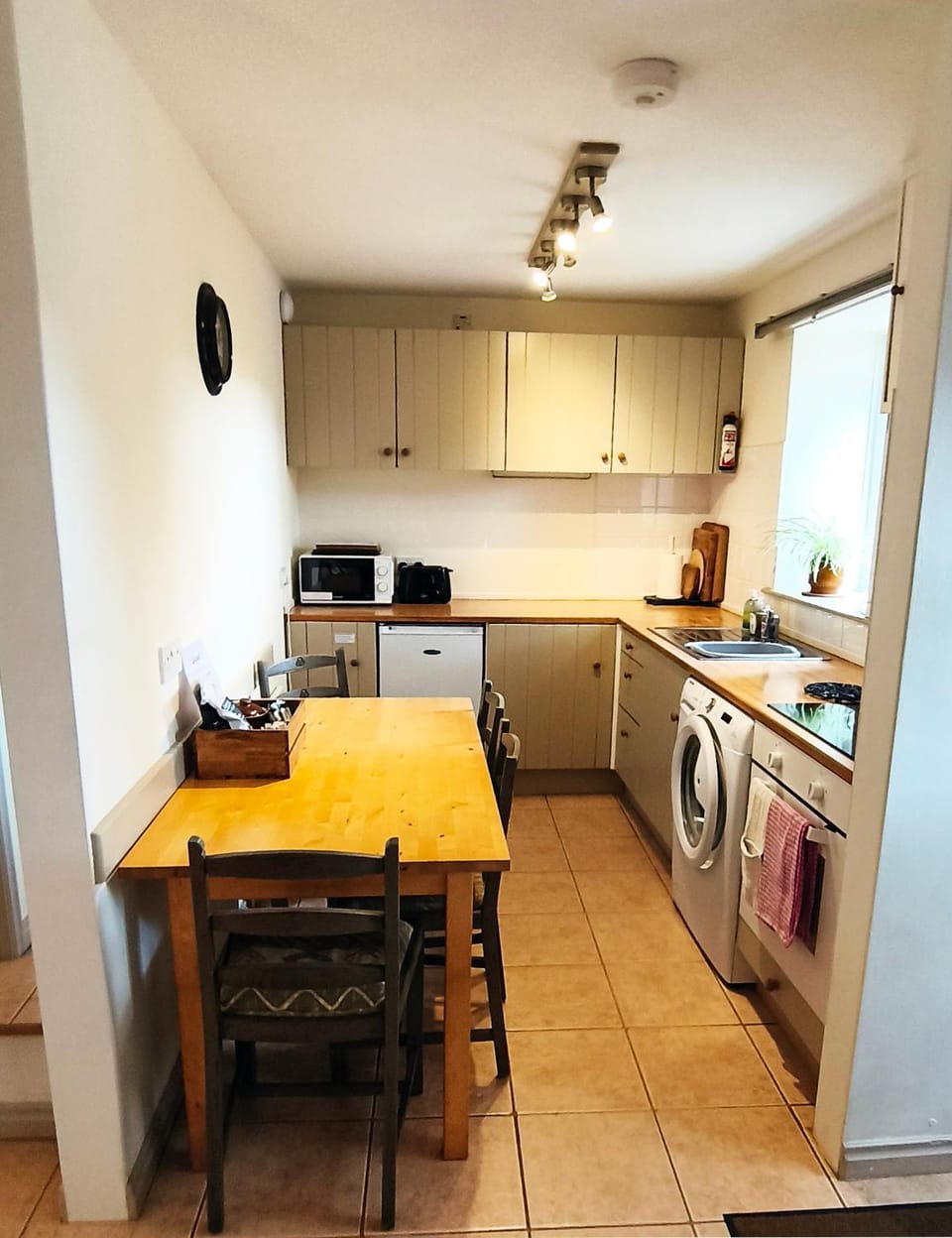 Dining area, microwave, oven, stove, toaster, washing machine, kitchen