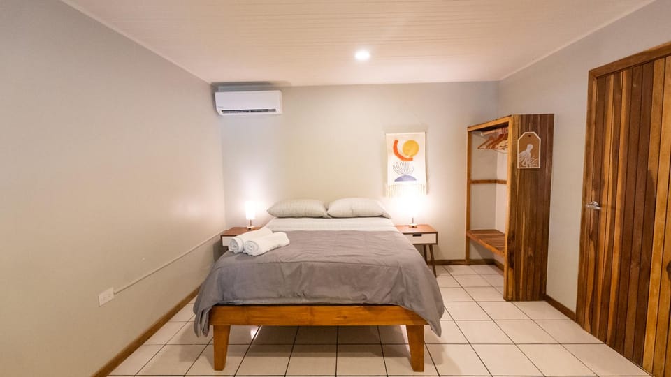 Bed, Decorative detail, Bedroom, towels, wardrobe, air conditioner