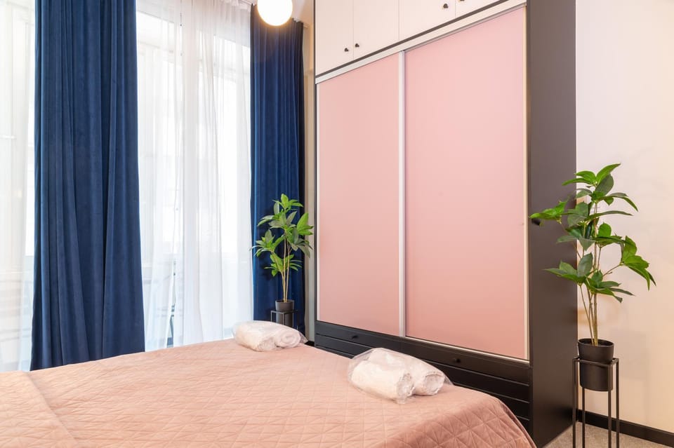Bed, towels, wardrobe