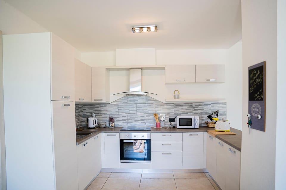 Kitchen or kitchenette, oven, stove, toaster