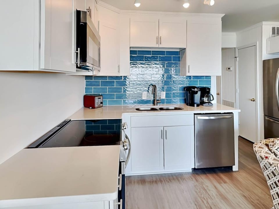 Kitchen or kitchenette, dishwasher, microwave, stove, toaster, kitchen