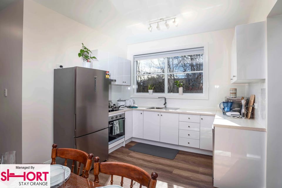Kitchen or kitchenette, dishwasher, oven, stove