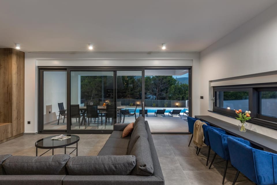 Living room, Seating area, Dining area, Pool view
