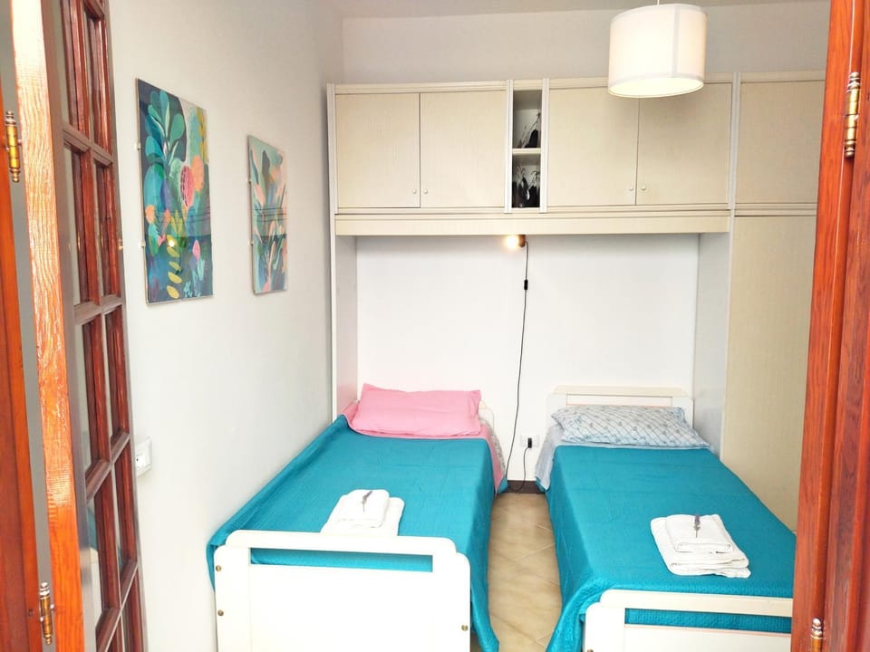 Bed, towels, wardrobe