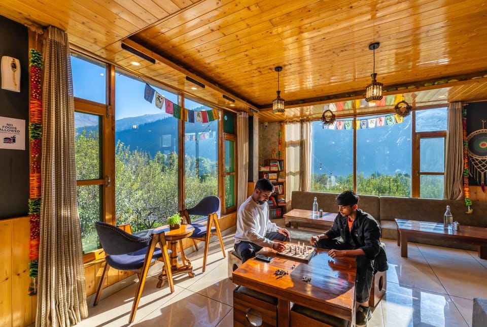 Restaurant/places to eat, People, Natural landscape, Game Room, Seating area, Mountain view