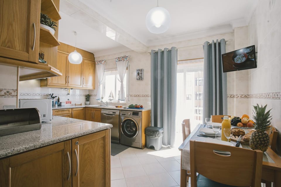 Kitchen or kitchenette, Dining area, dishwasher, stove, toaster, washing machine