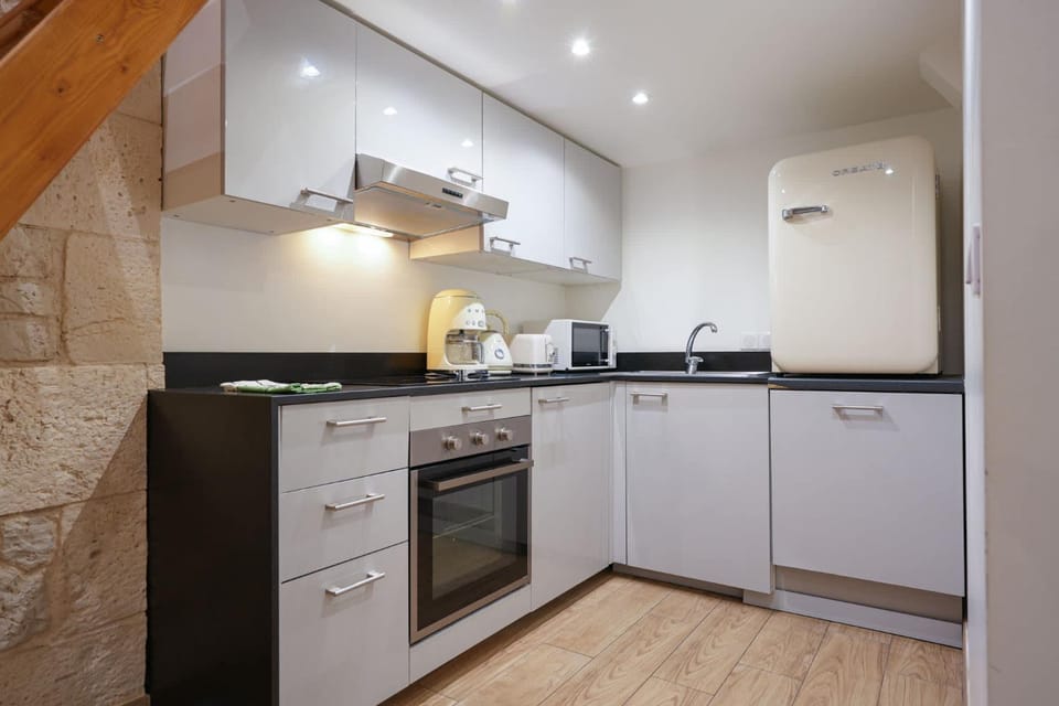 Kitchen or kitchenette, dishwasher, oven, stove, toaster
