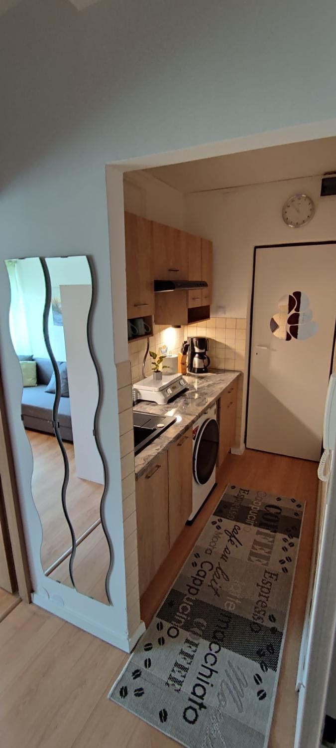 Kitchen or kitchenette, stove, washing machine