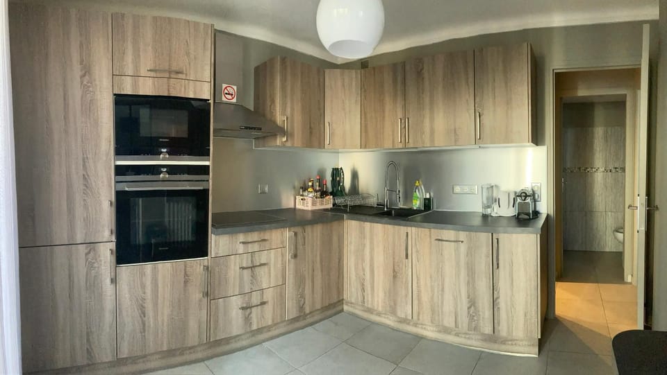 Kitchen or kitchenette, dishwasher, oven, stove